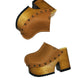 Brown leather clogs in a vintage 70s style. Super high vintage-style wooden heel. Sizes 33 to 47. High-end footwear handmade by Sol Caleyo.