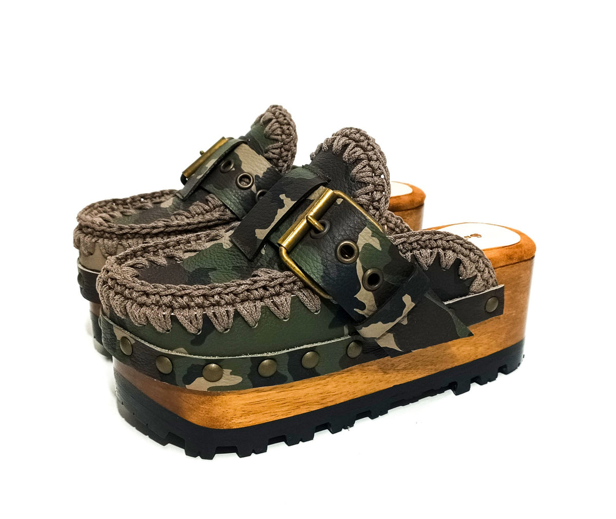 Handcrafted military camouflage and brown leather platform clog with unique crochet stitch edging and antique gold buckle detailing on a sturdy wooden base with a rugged black rubber outsole.