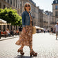 Handmade cowhide print and croc leather mule clogs with old-gold buckle, studs and 9 cm wooden heel by Sol Caleyo.