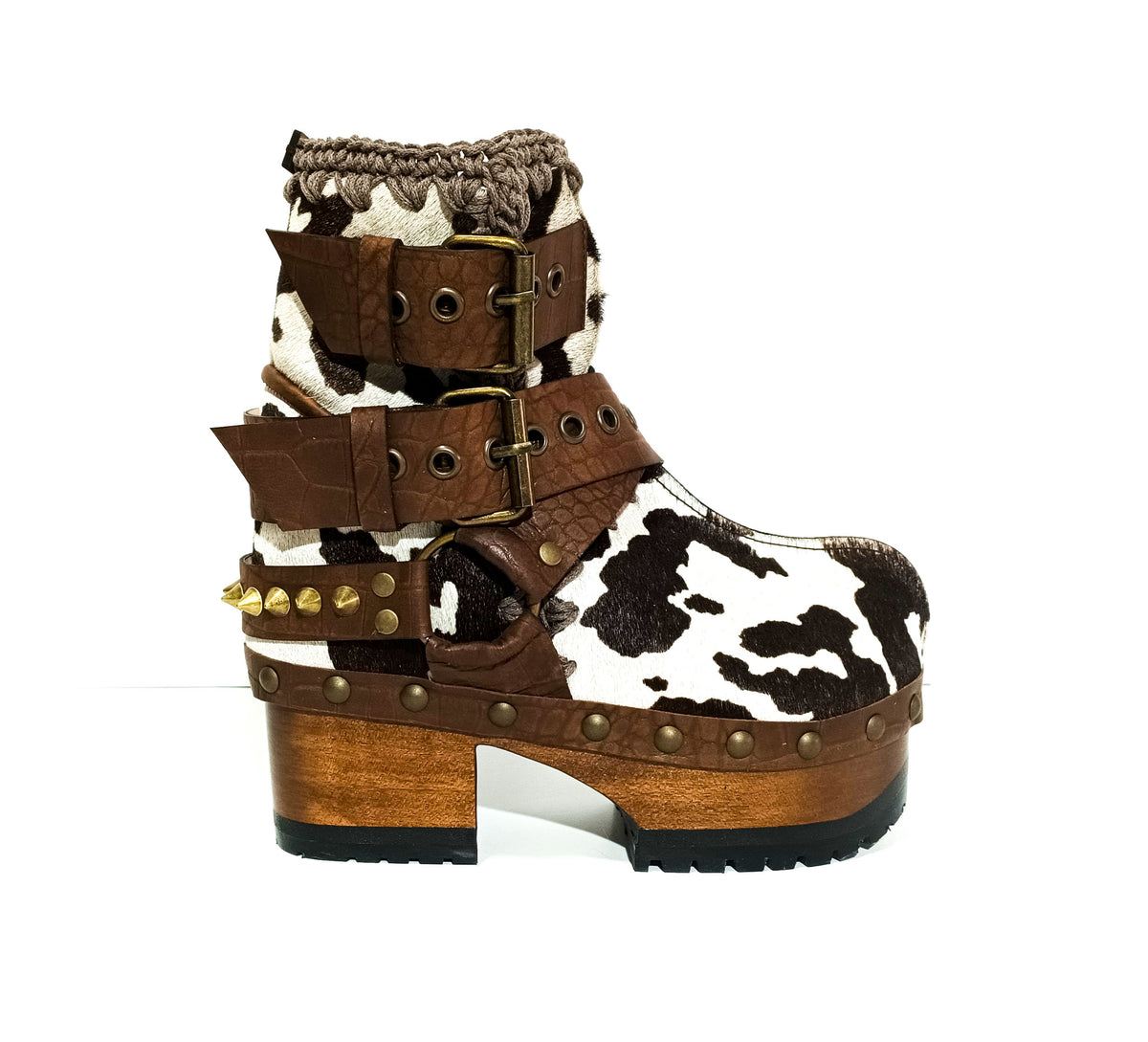 Dark brown spotted hair-on cowhide platform booties with chocolate croc-print straps, gold pyramid studs and 7 cm wooden heel by Sol Caleyo.