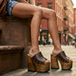 Dark brown handmade leather mule clogs with bronze-tone studs and 17 cm bell-style wooden heel by Sol Caleyo