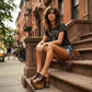 Model wearing the Brown Luxury Queen Sandals by Sol Caleyo, showcasing the 17 cm wooden platform and deep brown leather straps for a sophisticated, high-fashion look.