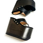 Pair of Sol Caleyo Kauai XL handcrafted flip flop sandals featuring black genuine leather straps, silver studs, and a high wengue-colored wooden platform sole.