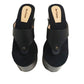 Pair of Sol Caleyo Kauai XL handcrafted flip flop sandals featuring black genuine leather straps, silver studs, and a high wengue-colored wooden platform sole.