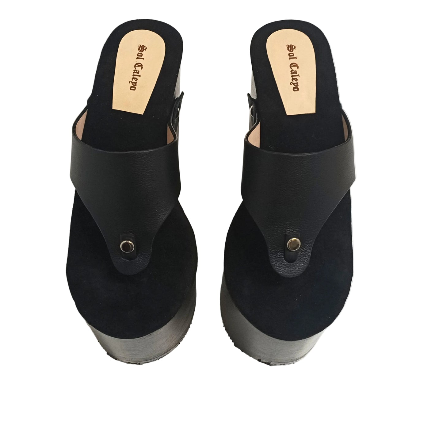 Pair of Sol Caleyo Kauai XL handcrafted flip flop sandals featuring black genuine leather straps, silver studs, and a high wengue-colored wooden platform sole.