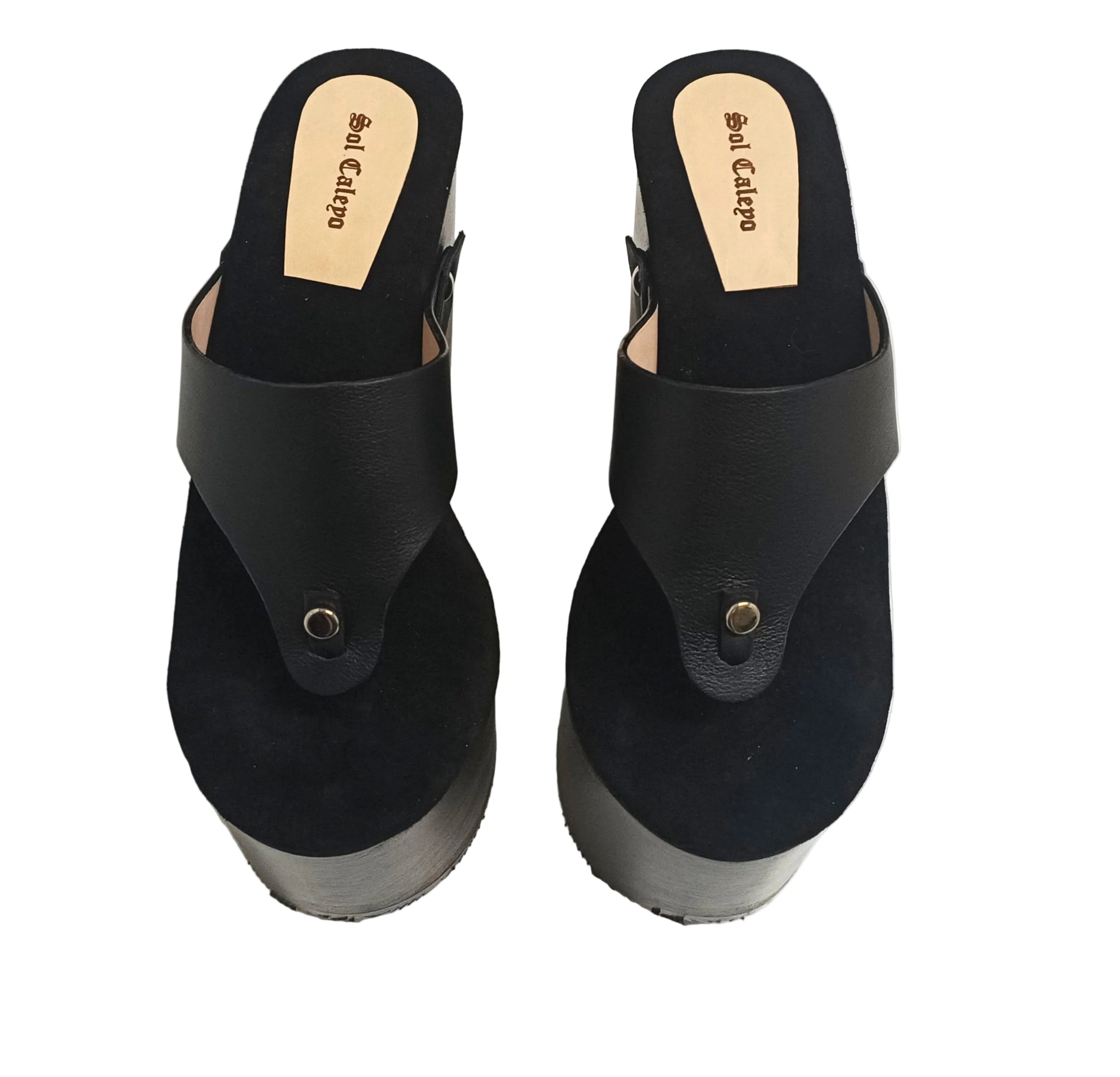 Pair of Sol Caleyo Kauai XL handcrafted flip flop sandals featuring black genuine leather straps, silver studs, and a high wengue-colored wooden platform sole.