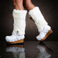 White fur boots with wooden wedge. White bohemian style leather boots. Handmade clogs shoes. White fur boots decorated with feathers, natural shells and horns. High-end handmade footwear by Sol Caleyo. Handmade Furry Shoes.