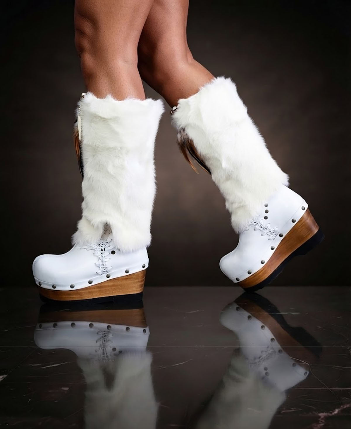 White fur boots with wooden wedge. White bohemian style leather boots. Handmade clogs shoes. White fur boots decorated with feathers, natural shells and horns. High-end handmade footwear by Sol Caleyo. Handmade Furry Shoes.