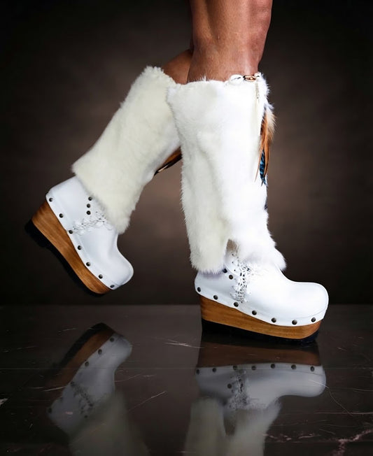 White fur boots with wooden wedge. White bohemian style leather boots. Handmade clogs shoes. White fur boots decorated with feathers, natural shells and horns. High-end handmade footwear by Sol Caleyo. Handmade Furry Shoes.