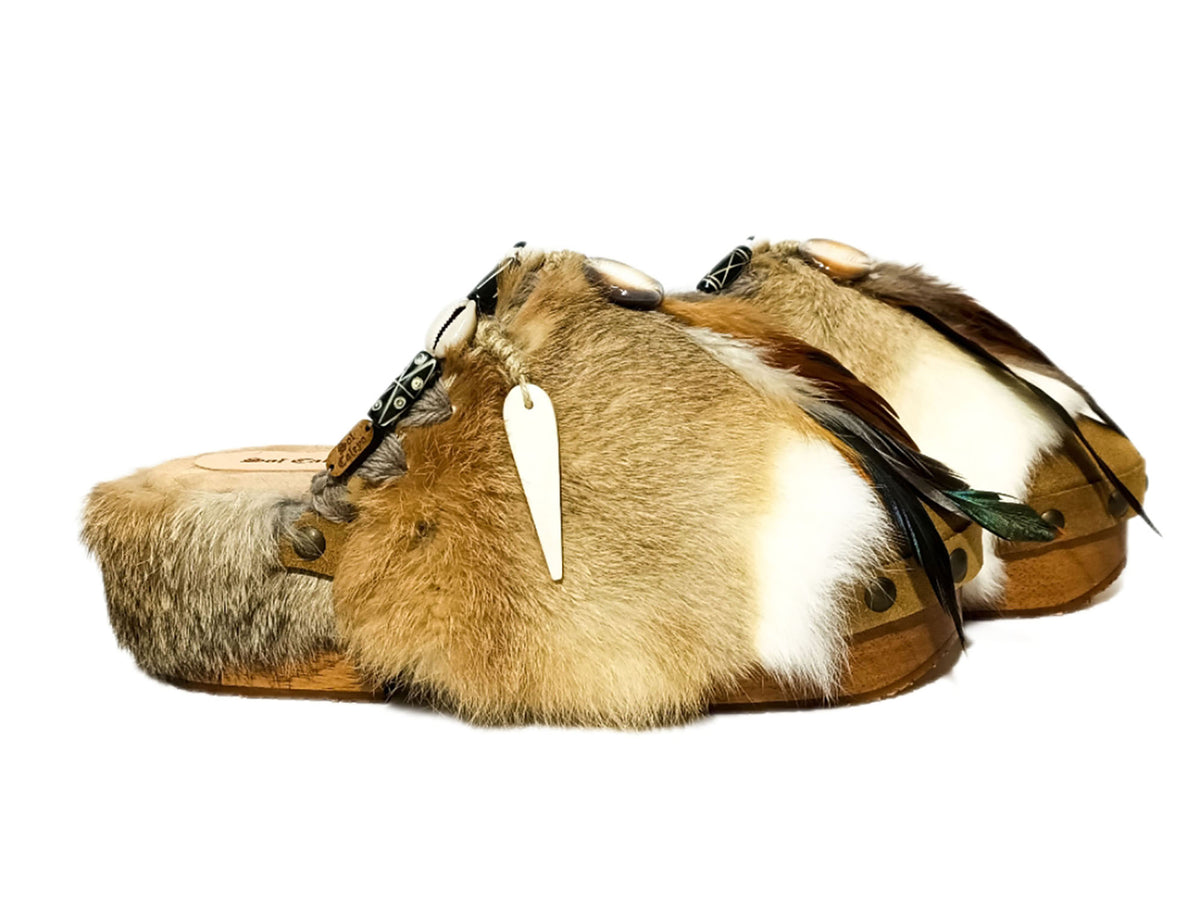 Handmade boho suede platform clogs with rabbit fur, carved bone, shells and feathers by Sol Caleyo