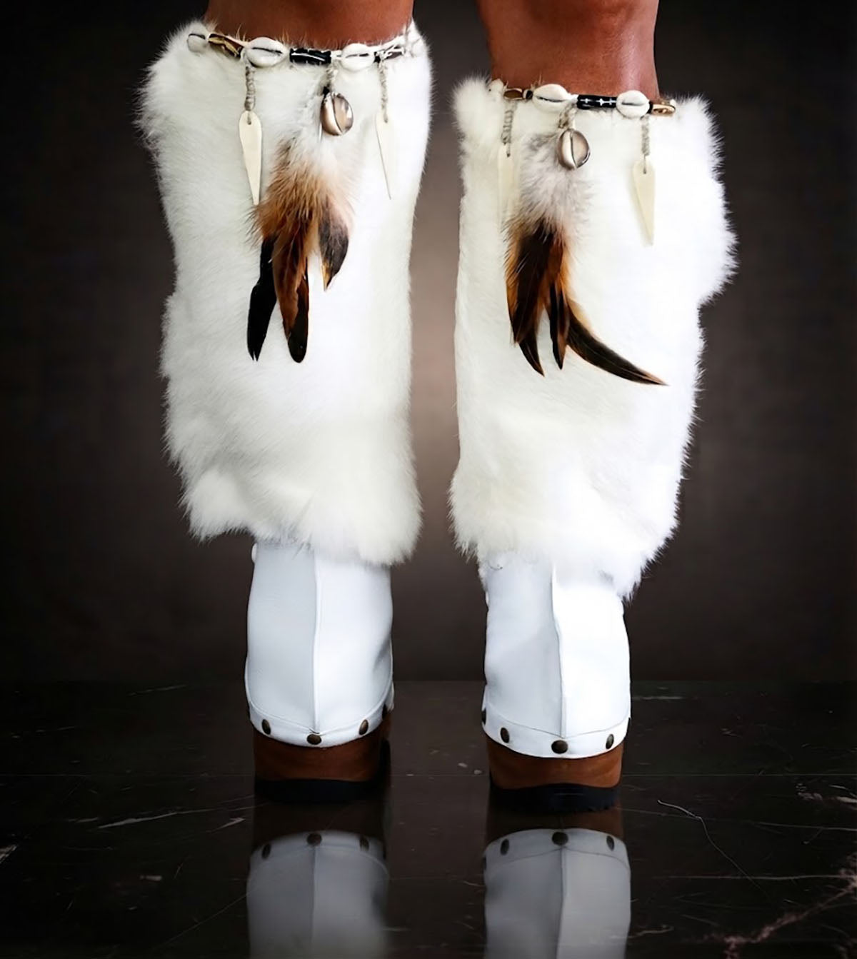 White fur boots with wooden wedge. White bohemian style leather boots. Handmade clogs shoes. White fur boots decorated with feathers, natural shells and horns. High-end handmade footwear by Sol Caleyo. Handmade Furry Shoes.