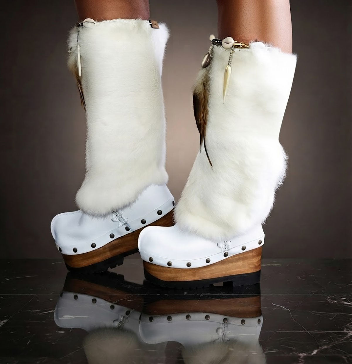 White fur boots with wooden wedge. White bohemian style leather boots. Handmade clogs shoes. White fur boots decorated with feathers, natural shells and horns. High-end handmade footwear by Sol Caleyo. Handmade Furry Shoes.