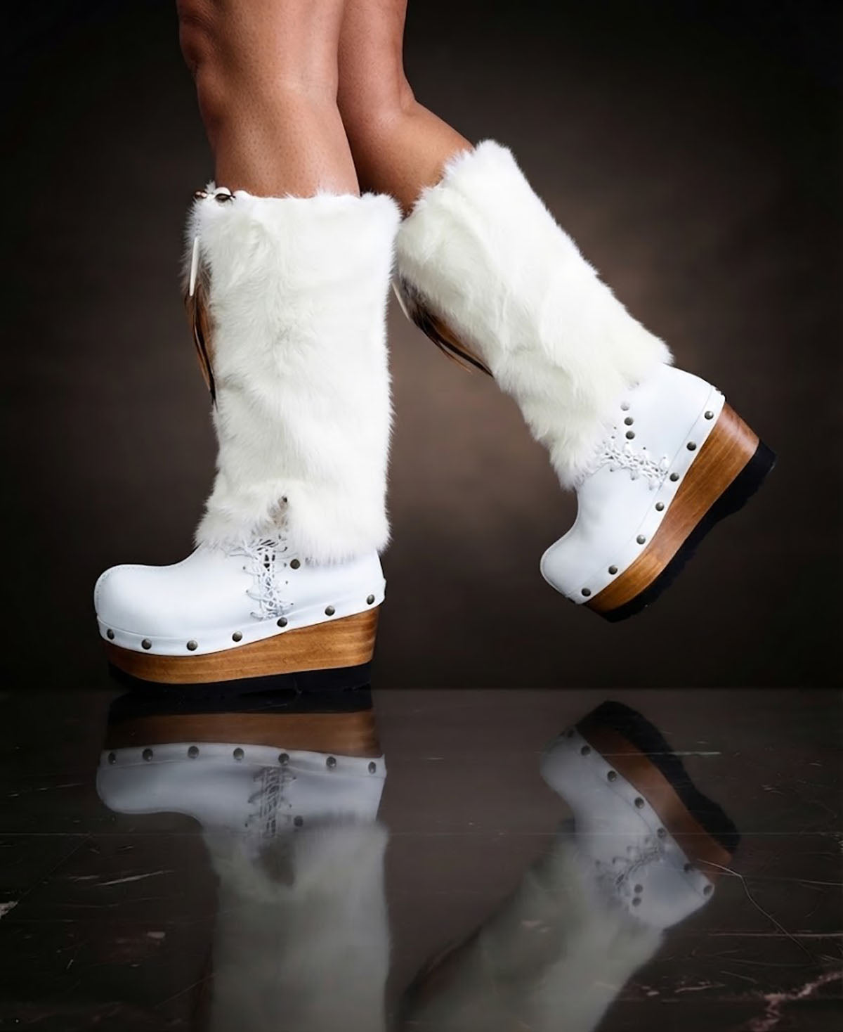White fur boots with wooden wedge. White bohemian style leather boots. Handmade clogs shoes. White fur boots decorated with feathers, natural shells and horns. High-end handmade footwear by Sol Caleyo. Handmade Furry Shoes.