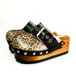 Handmade glitter leopard print leather open-back wedge mule clogs with antique-silver studs and buckle by Sol Caleyo.