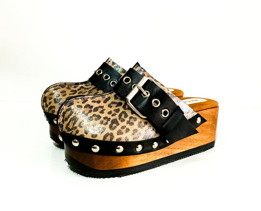 Handmade glitter leopard print leather open-back wedge mule clogs with antique-silver studs and buckle by Sol Caleyo.