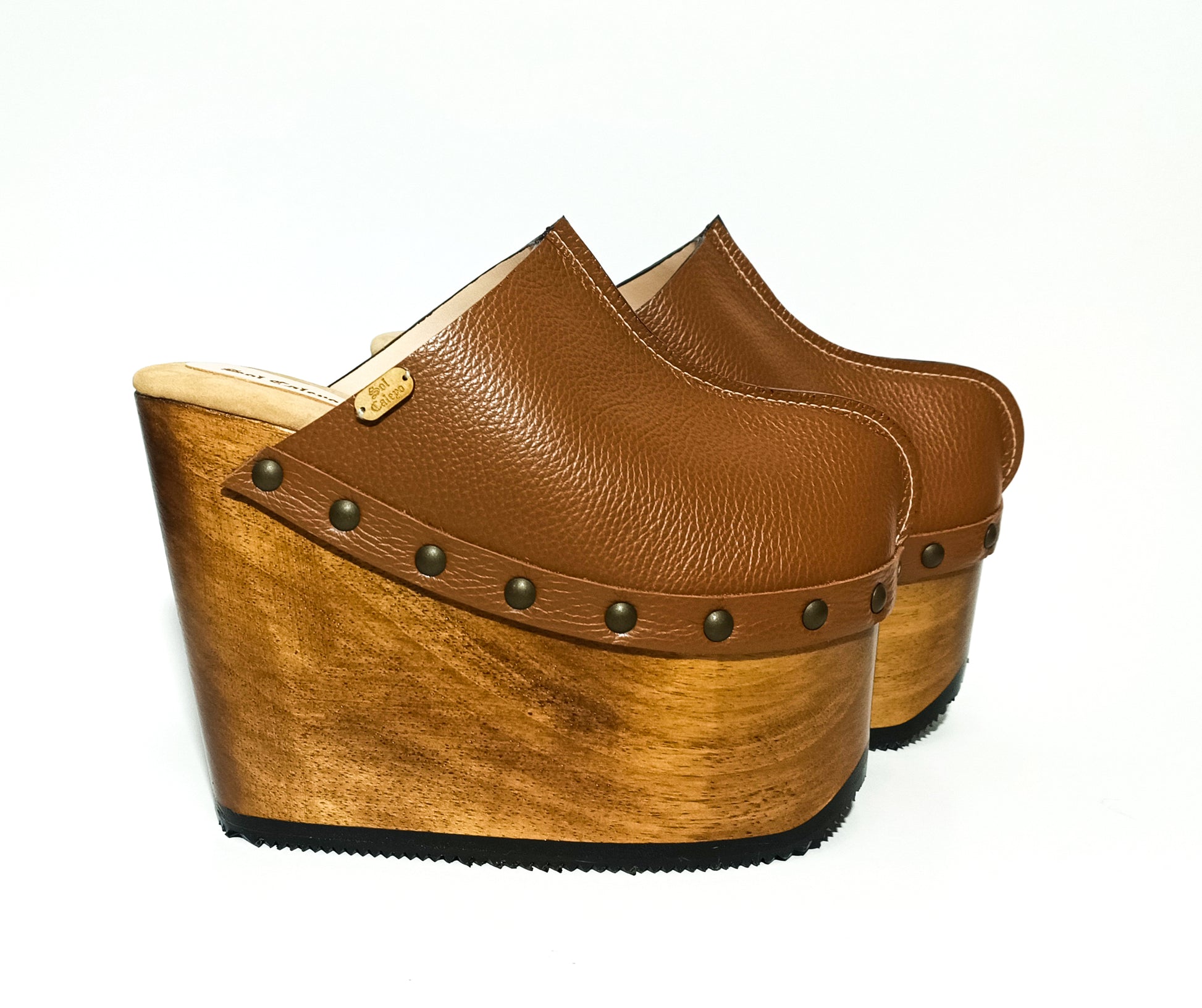 Vintage inspired, 70s style platform clogs with super high heels. Super high wooden wedge made in closed leather. Size from 34 to 47. Handmade to order. The Chicago Clogs are an exclusive design by Sol Caleyo.
