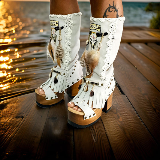 White suede leather platform boots sandals, with hand painted buffalo, decorated with feathers, natural shells, coins and horns, totally handmade to order. An authentic bohemian style boot handmade by Sol Caleyo. Sizes 34 to 47.