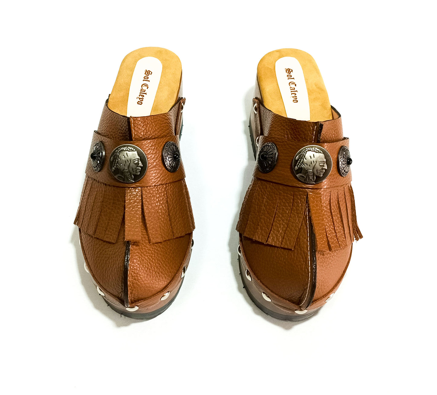 Discover the timeless elegance of Indian Clogs by Sol Caleyo, where the richness of leather meets the warmth of wood. Handmade to order in sizes 34 to 47, these clogs perfectly blend the natural allure of leather and the rustic charm of wood.