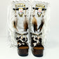 Handmade cowboy boots, white boots with cowhide and fringes. Cowboy style boots with hand painted buffalo, feathers, coins and natural shells. Vintage style platform boots. High-end leather footwear handmade by Sol Caleyo.