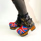 Biker style platform boots with England flag. Leather ankle boots with england flag, buckles and studs. High-end handmade footwear by Sol Caleyo.