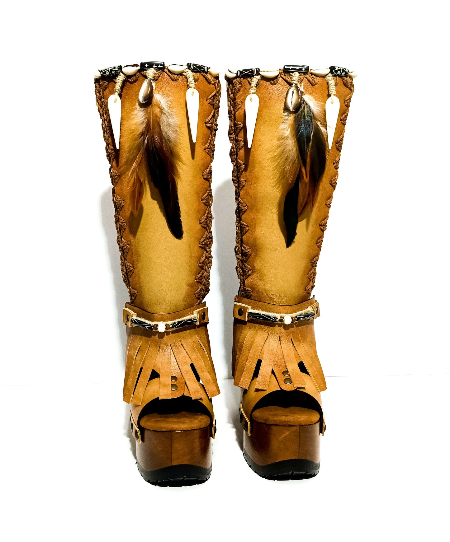 Bohemian style beige platform boots. Bohemian style wooden heeled boots decorated with feathers, shells and horns. High-end footwear handmade by Sol Caleyo.