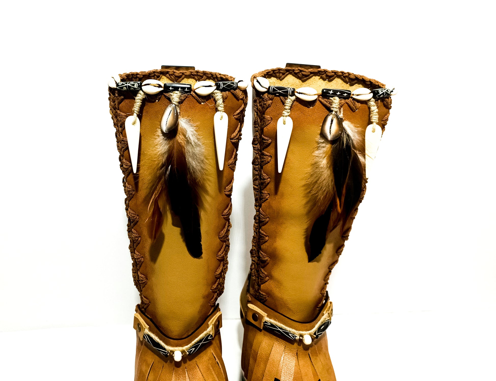 Bohemian style beige platform boots. Bohemian style wooden heeled boots decorated with feathers, shells and horns. High-end footwear handmade by Sol Caleyo.