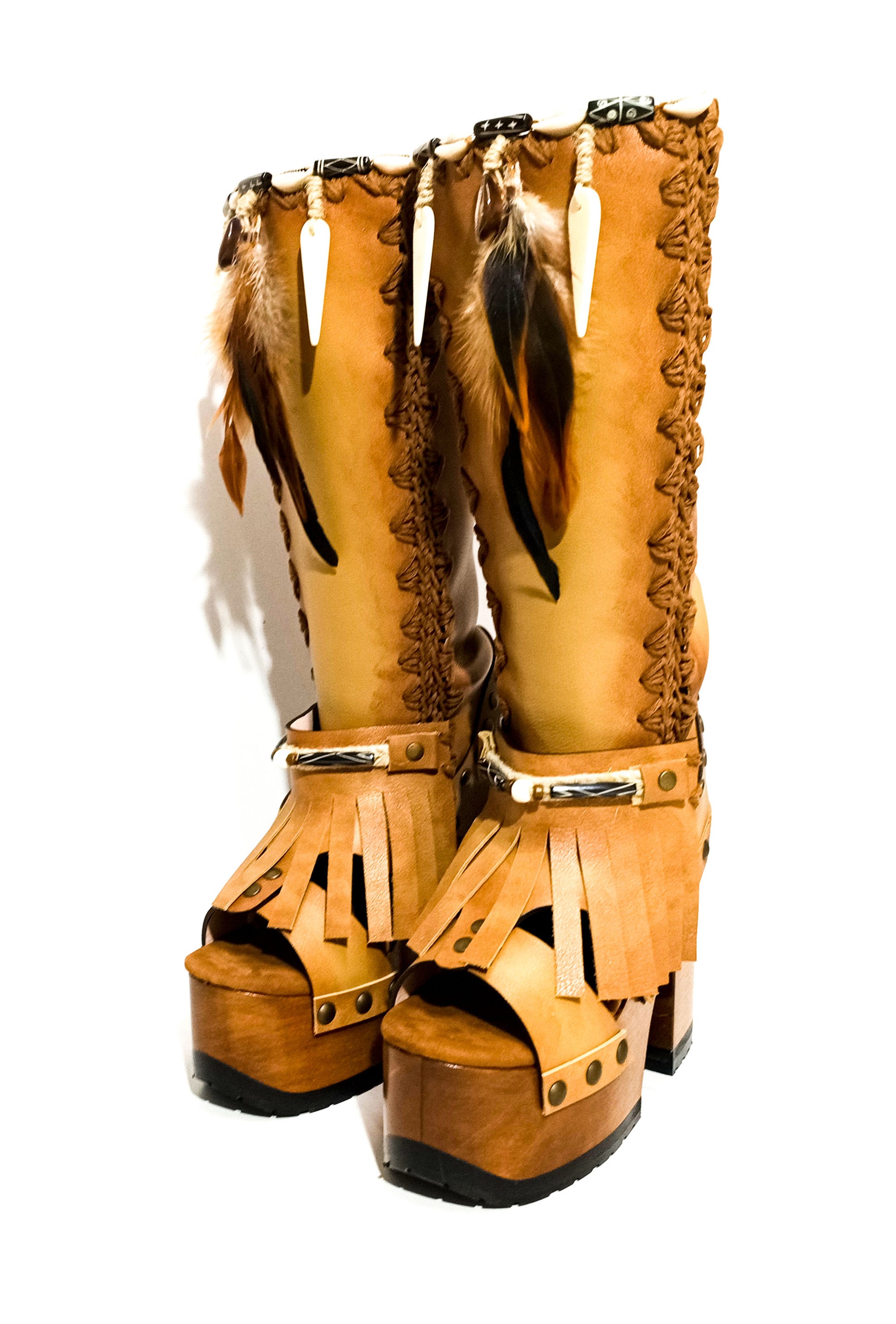 Bohemian style beige platform boots. Bohemian style wooden heeled boots decorated with feathers, shells and horns. High-end footwear handmade by Sol Caleyo.