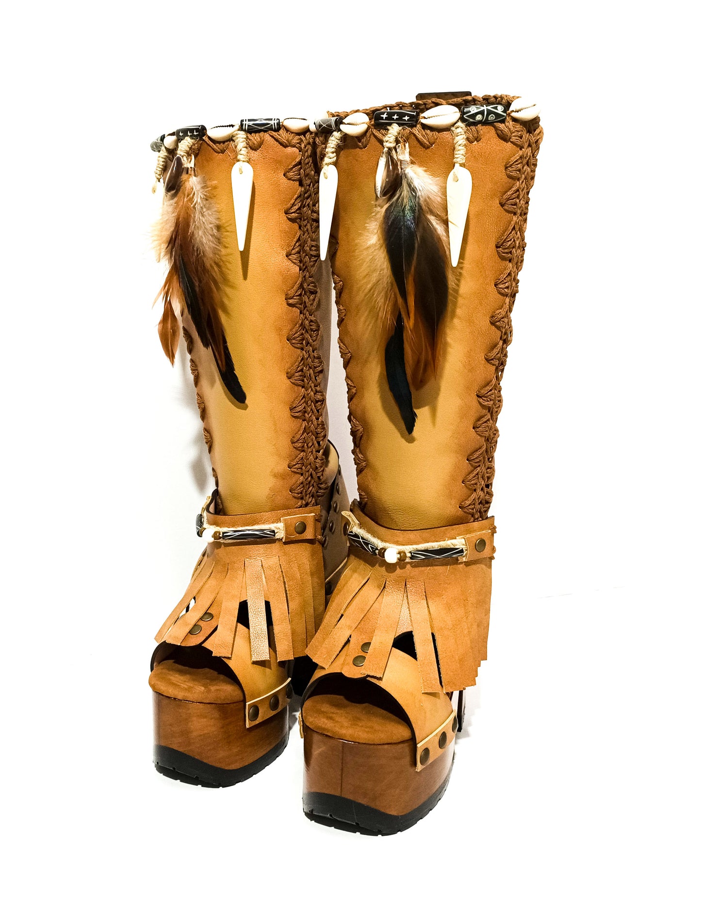 Bohemian style beige platform boots. Bohemian style wooden heeled boots decorated with feathers, shells and horns. High-end footwear handmade by Sol Caleyo.