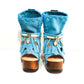 Bohemian style turquoise suede leather boots. Turquoise boots with wooden heel. Turquoise boots decorated with coins, horns and feathers, Boho Chic style. High-end handmade footwear by Sol Caleyo.