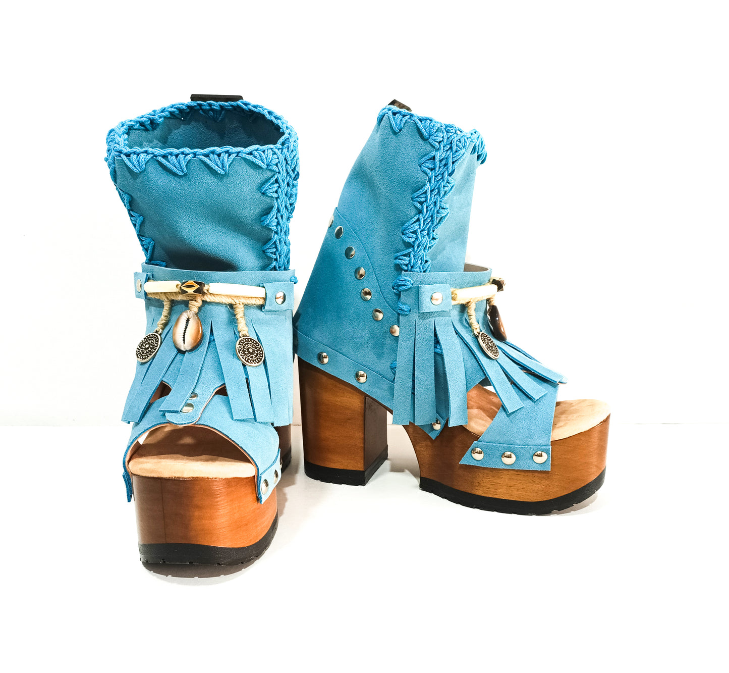 Bohemian style turquoise suede leather boots. Turquoise boots with wooden heel. Turquoise boots decorated with coins, horns and feathers, Boho Chic style. High-end handmade footwear by Sol Caleyo.