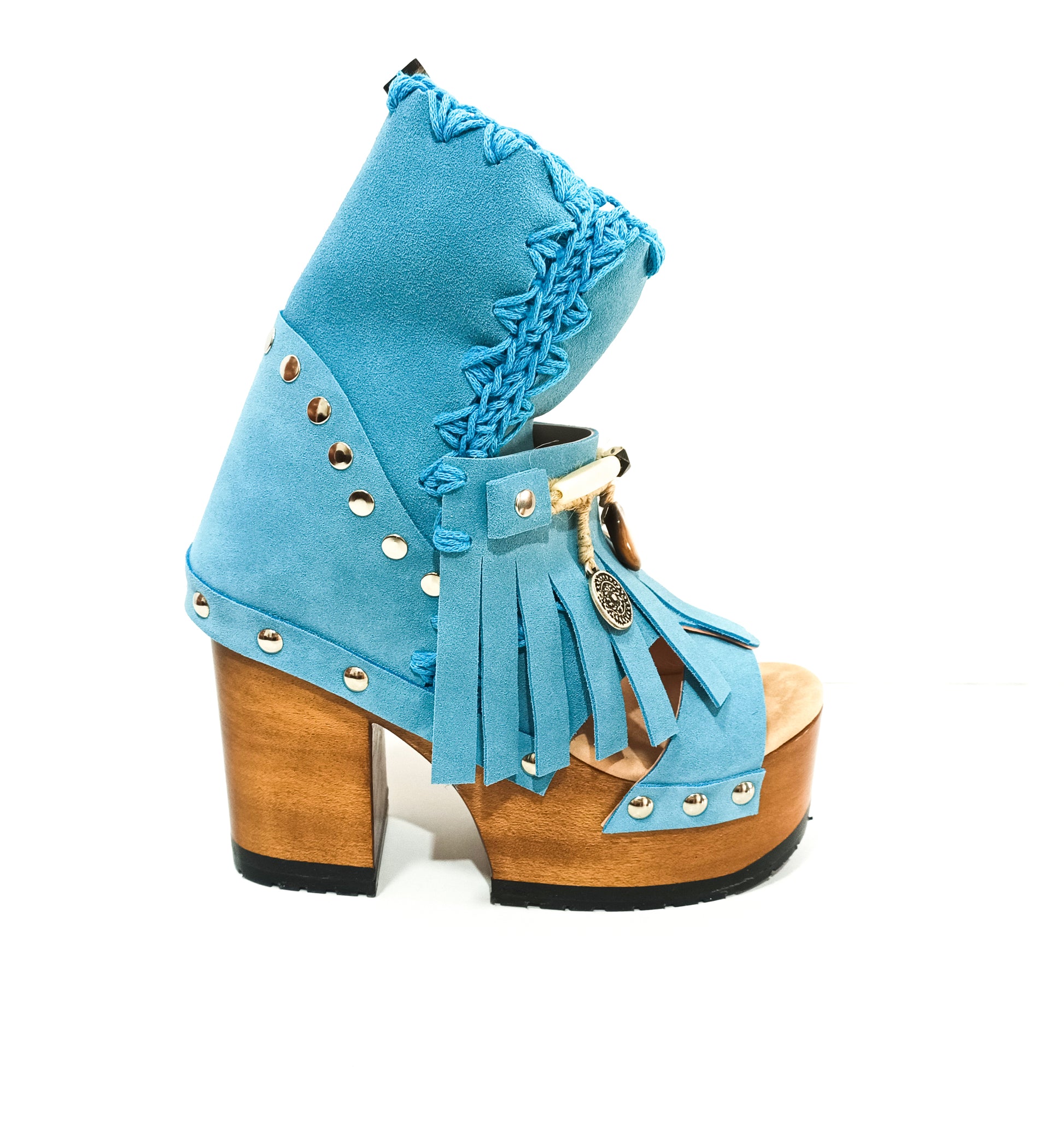 Bohemian style turquoise suede leather boots. Turquoise boots with wooden heel. Turquoise boots decorated with coins, horns and feathers, Boho Chic style. High-end handmade footwear by Sol Caleyo.