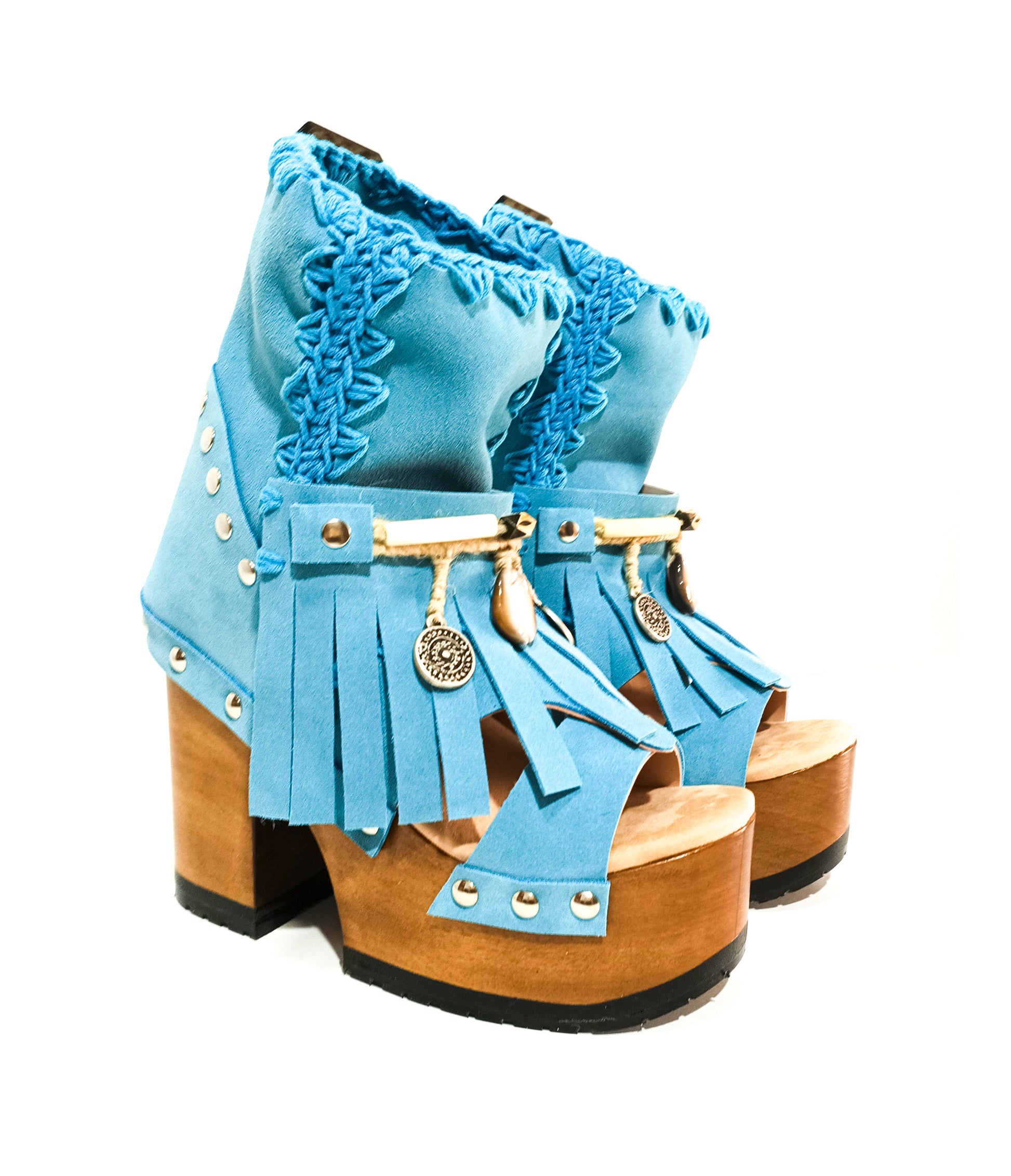 Bohemian style turquoise suede leather boots. Turquoise boots with wooden heel. Turquoise boots decorated with coins, horns and feathers, Boho Chic style. High-end handmade footwear by Sol Caleyo.