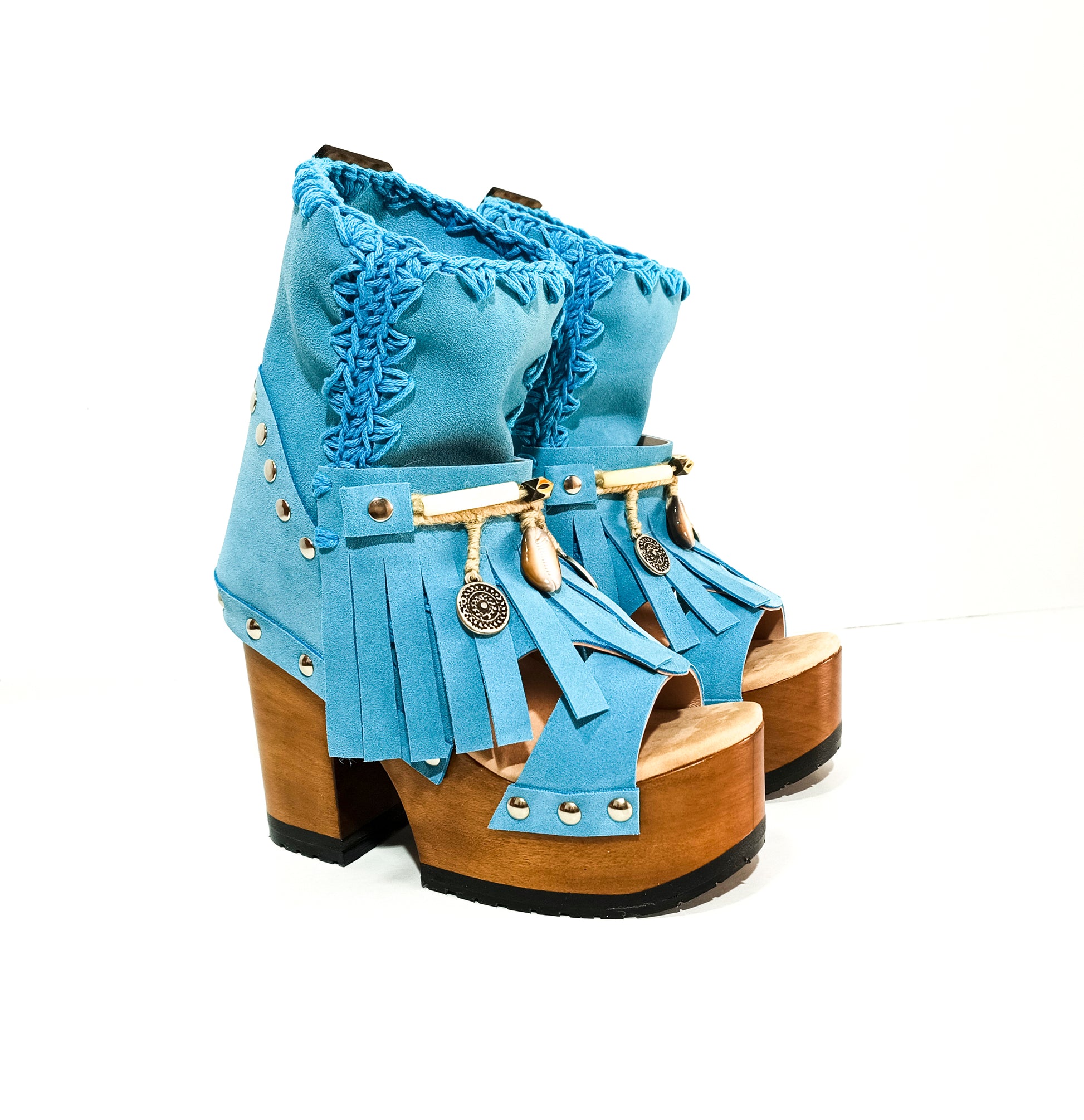 Bohemian style turquoise suede leather boots. Turquoise boots with wooden heel. Turquoise boots decorated with coins, horns and feathers, Boho Chic style. High-end handmade footwear by Sol Caleyo.