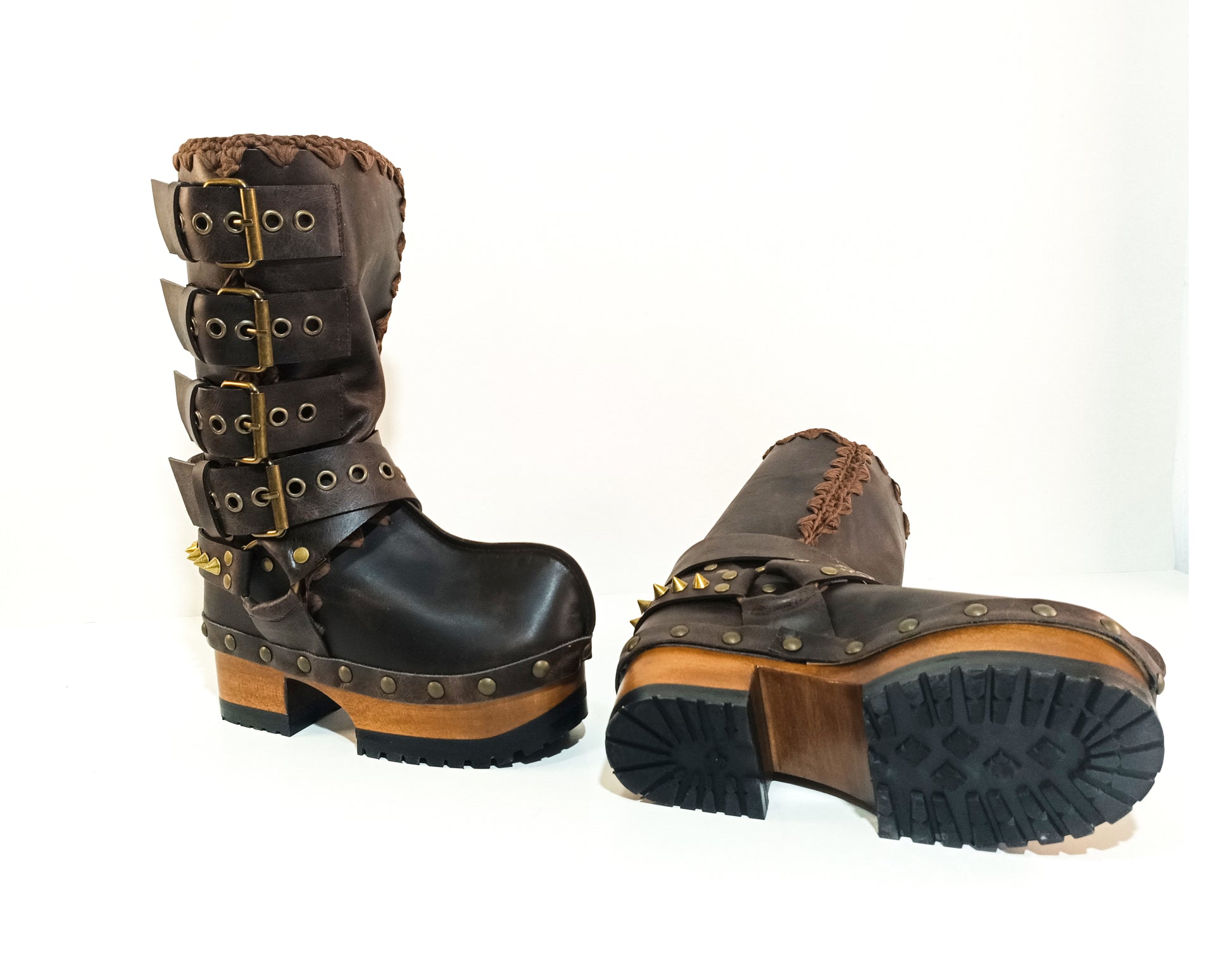 Handmade leather clogs. Dark brown leather biker boots. Leather boots with wooden heels. Leather boots with buckles. High-end footwear handmade by Sol Caleyo.