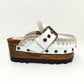 White wooden wedge clogs. White leather mules. Oxford style buckle clogs. High quality handmade shoes by Sol Caleyo.