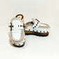 White wooden wedge clogs. White leather mules. Oxford style buckle clogs. High quality handmade shoes by Sol Caleyo.