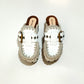 White wooden wedge clogs. White leather mules. Oxford style buckle clogs. High quality handmade shoes by Sol Caleyo.