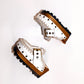 White wooden wedge clogs. White leather mules. Oxford style buckle clogs. High quality handmade shoes by Sol Caleyo.