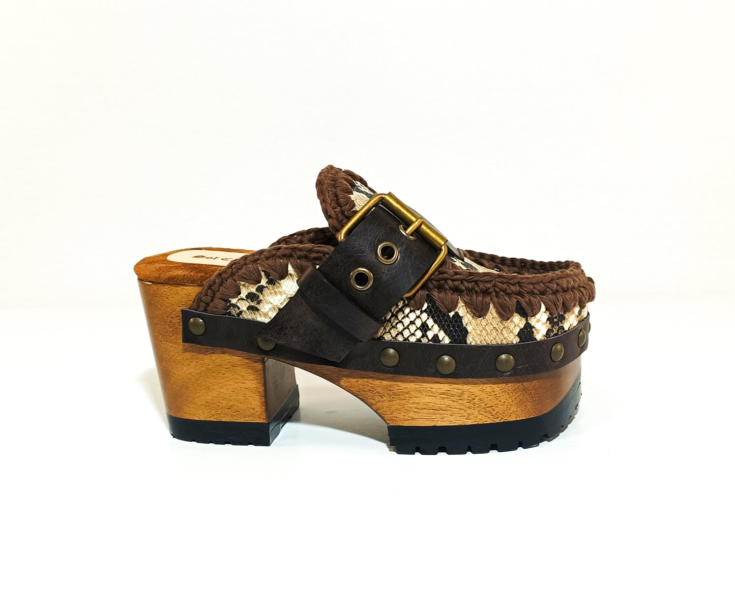 Snake leather mule. Wooden clogs with snake leather. Oxford style clogs with buckle. High-end handmade footwear by Sol Caleyo.