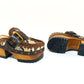 Snake leather mule. Wooden clogs with snake leather. Oxford style clogs with buckle. High-end handmade footwear by Sol Caleyo.