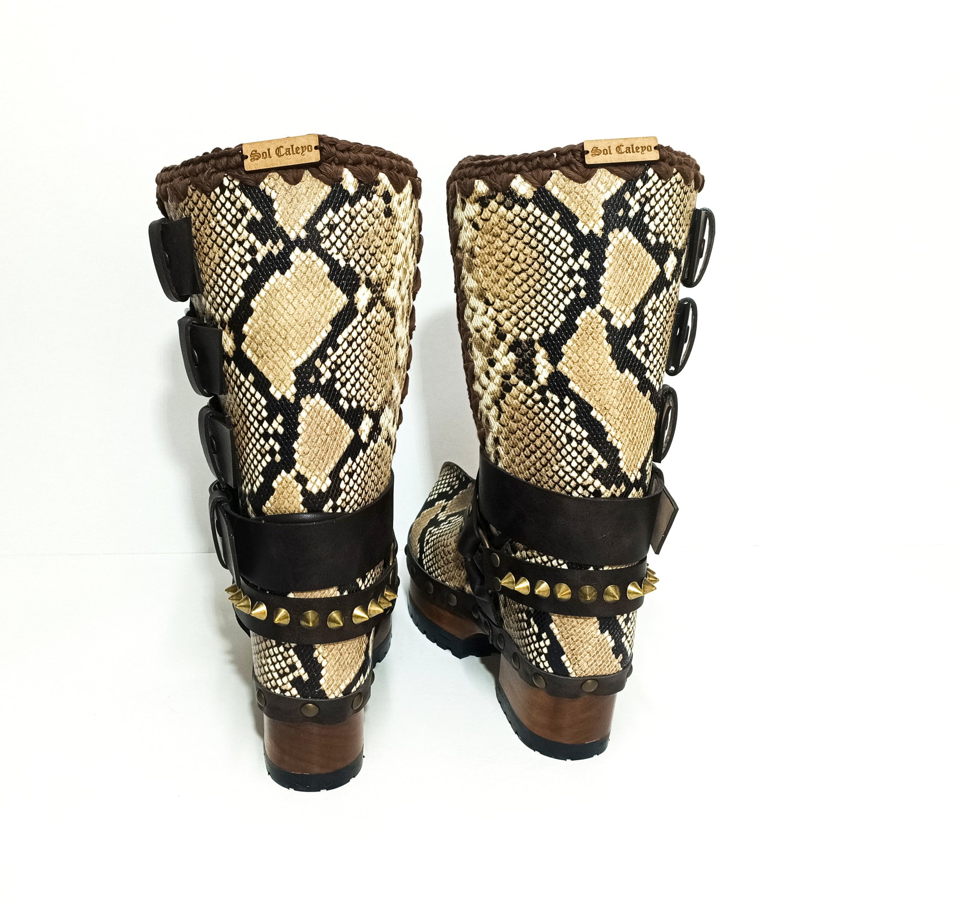 Handmade snake skin clogs. Biker-style snake boots. Leather boots with wooden heels. High-end footwear handmade by Sol Caleyo.