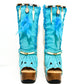 Turquoise bohemian-style boots, handmade. Platform boots with wooden heel. Turquoise bohemian-style boots decorated with feathers, shells and carved bone. High-end footwear handmade by Sol Caleyo.