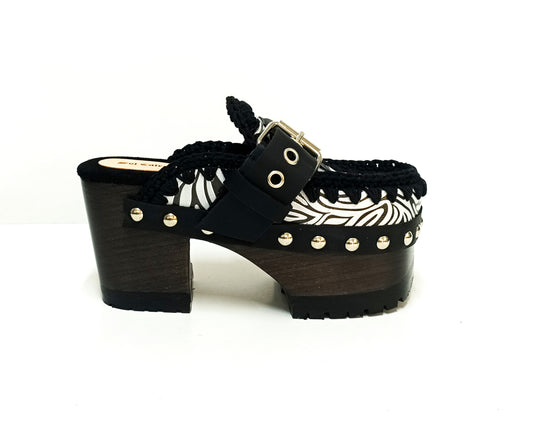 Zebra leather mules with wooden heels. Zebra clogs made from premium quality leather. High-end footwear handmade by Sol Caleyo.