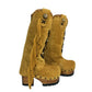 Front view of Sol Caleyo boho western boots showing black leather detailing and rounded wooden platform toe.