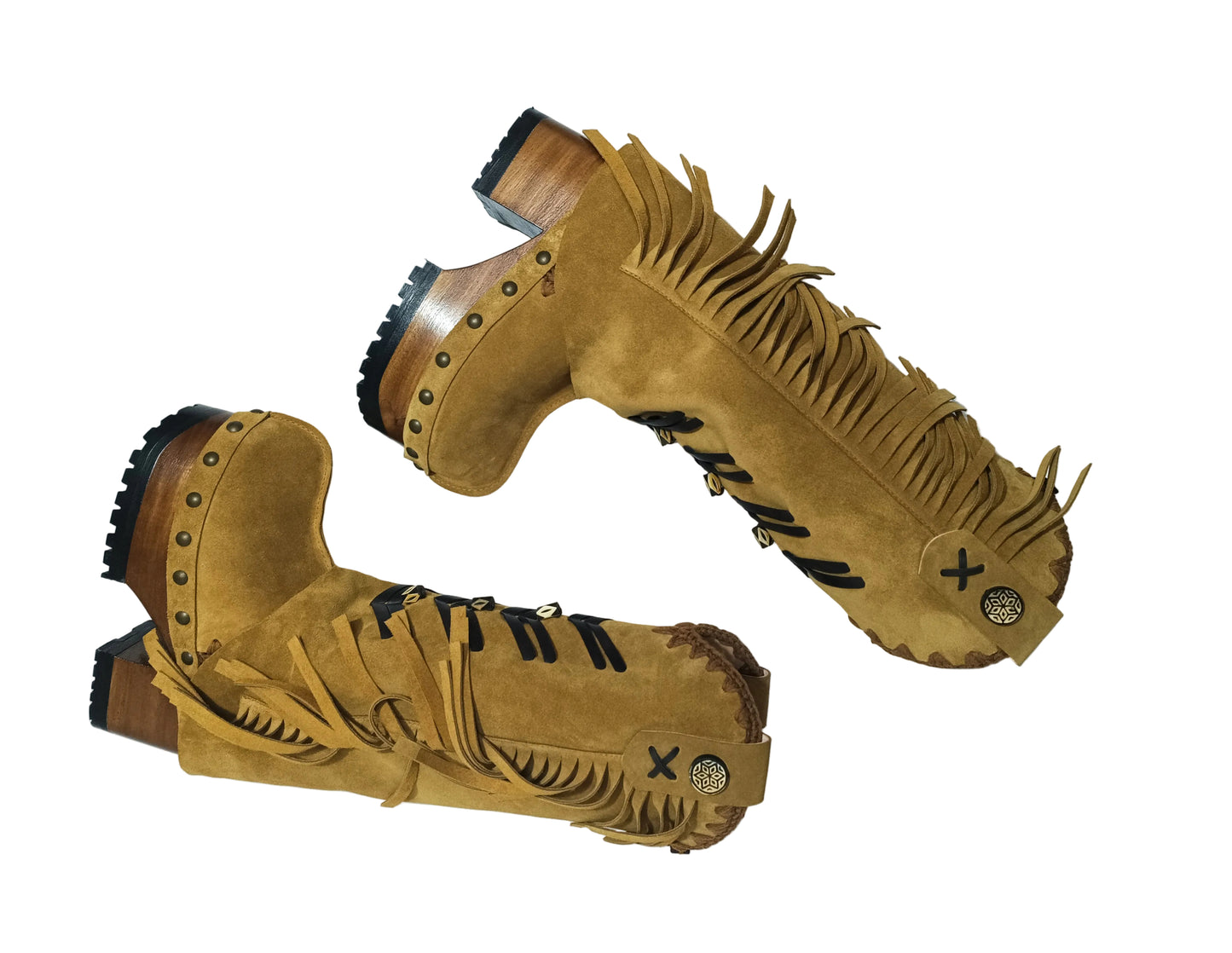 Close-up of suede texture, fringe and black leather appliqué on handmade western boots by Sol Caleyo.