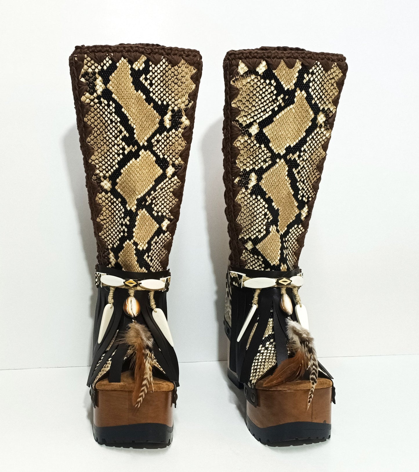 Handmade snake leather bohemian platform boots with wooden heel and fringe details by Sol Caleyo

