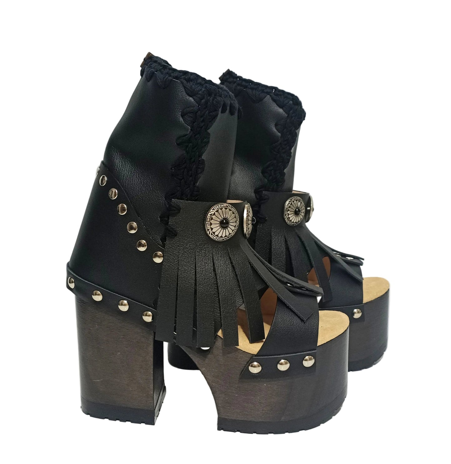 Sol Caleyo handmade platform sandals in genuine full-grain leather with wood sole and 12cm heel. Featuring silver conchos, black stones, and tractor rubber sole. Bohemian luxury footwear.