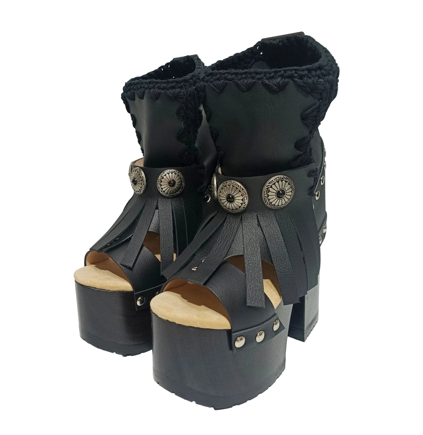 Sol Caleyo handmade platform sandals in genuine full-grain leather with wood sole and 12cm heel. Featuring silver conchos, black stones, and tractor rubber sole. Bohemian luxury footwear.