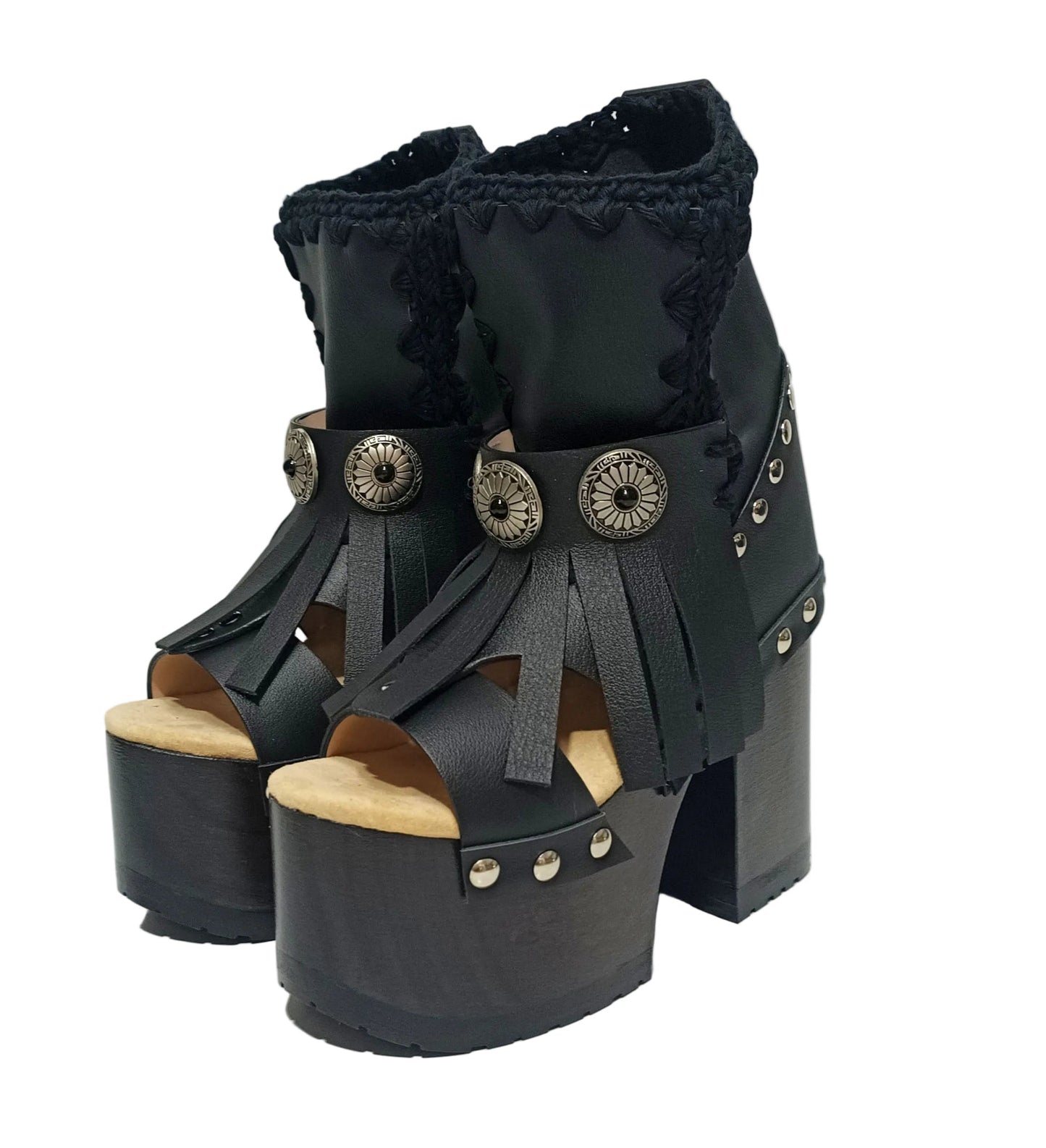 Sol Caleyo handmade platform sandals in genuine full-grain leather with wood sole and 12cm heel. Featuring silver conchos, black stones, and tractor rubber sole. Bohemian luxury footwear.