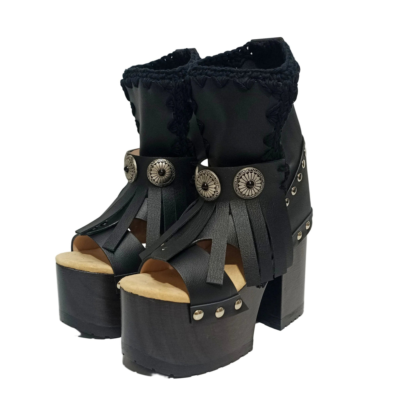 Sol Caleyo handmade platform sandals in genuine full-grain leather with wood sole and 12cm heel. Featuring silver conchos, black stones, and tractor rubber sole. Bohemian luxury footwear.